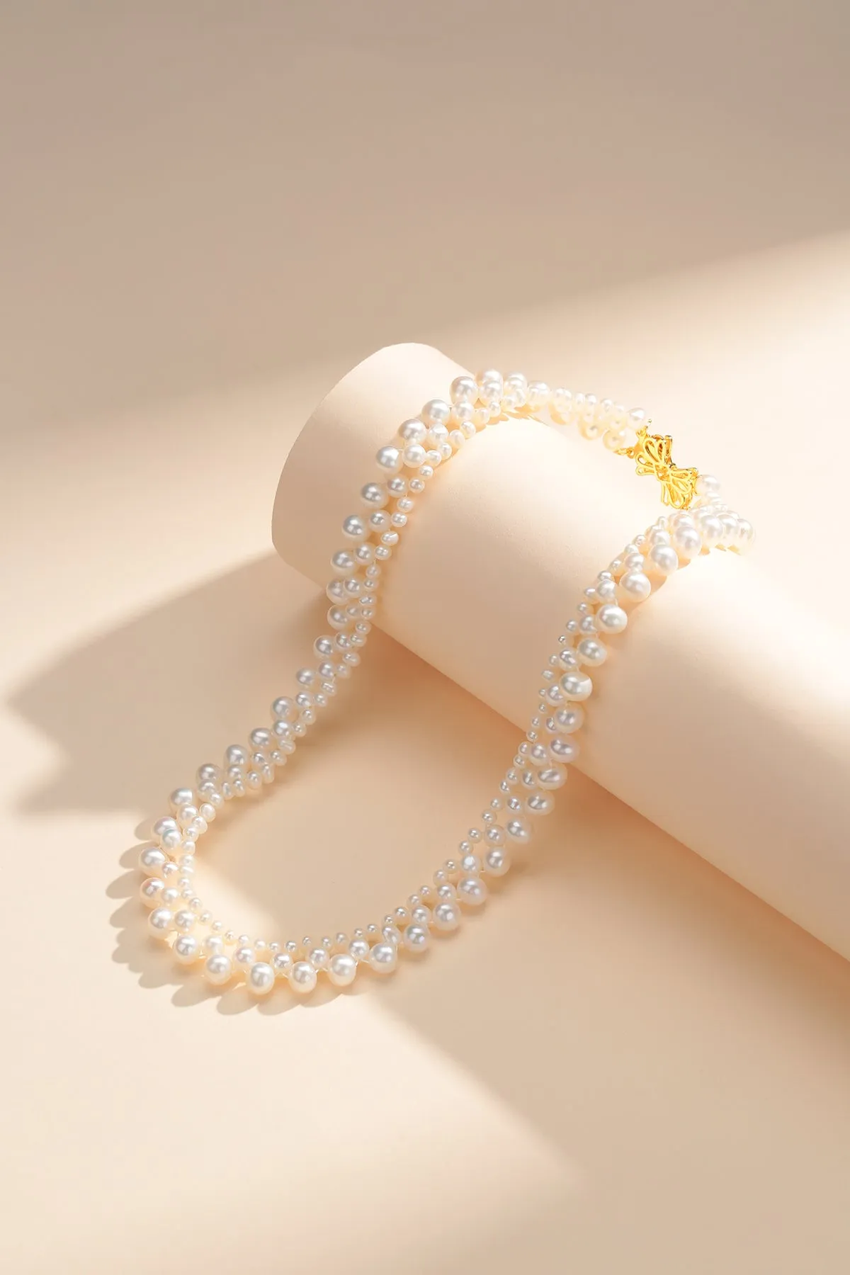 Gradual Pearl Braided Bow Necklace