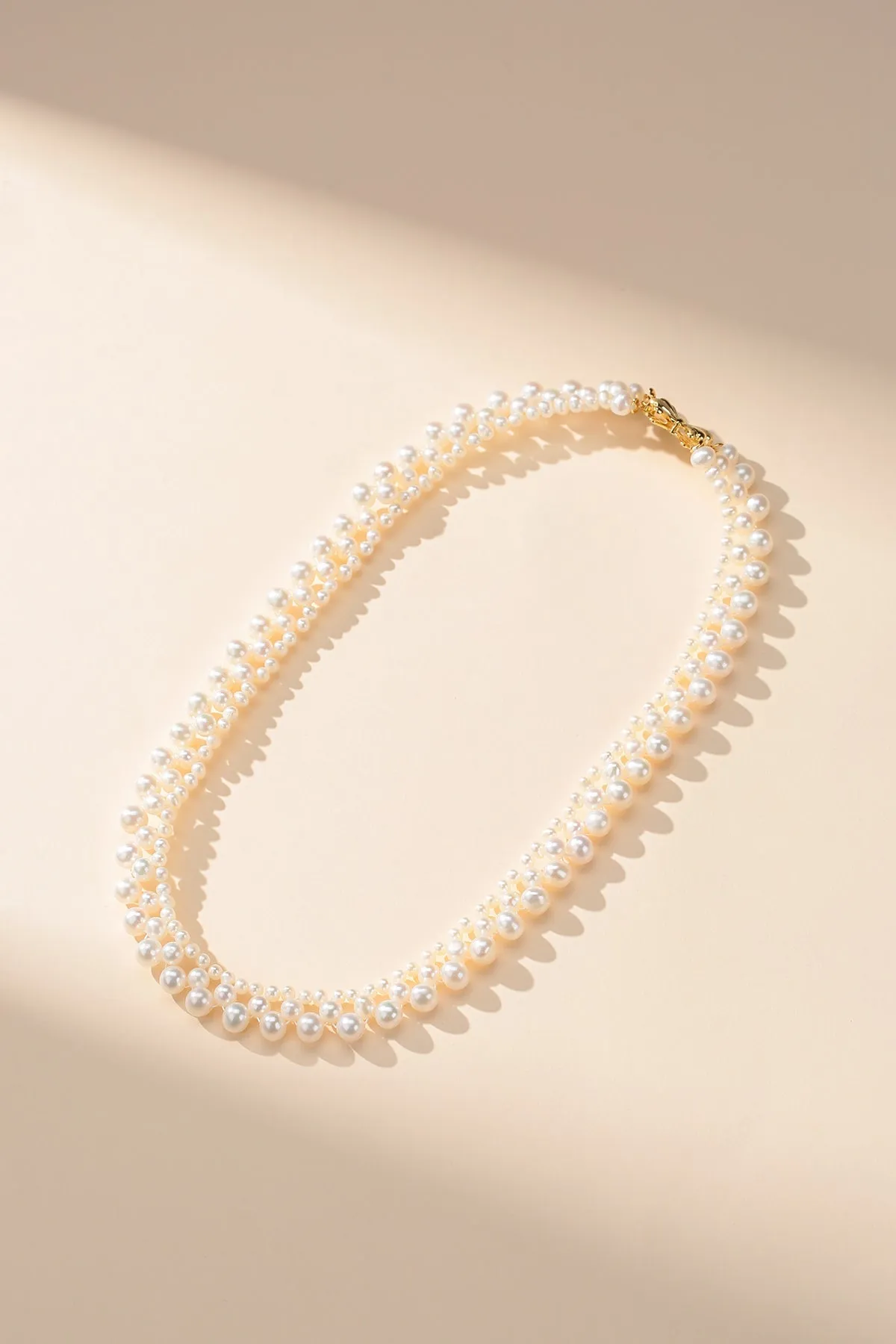 Gradual Pearl Braided Bow Necklace